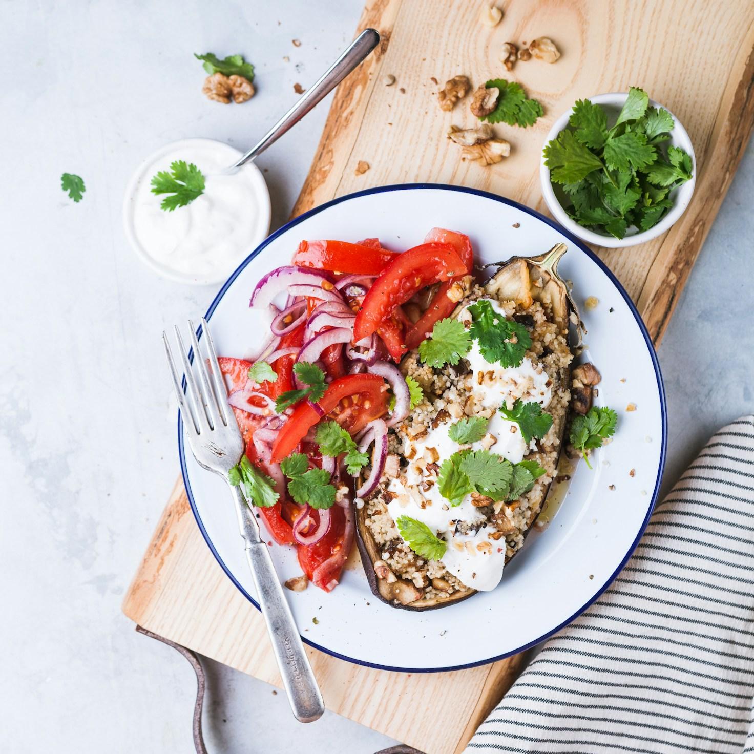 Community members collaborating in a modern kitchen space, sharing recipes and cooking techniques